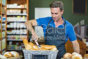 Male staff working at bakery store