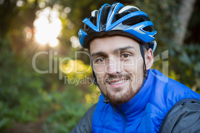 Portrait of male mountain biker in the forest