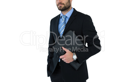 Mid section of businessman holding folder