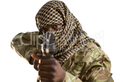 Portrait of soldier aiming with a rifle
