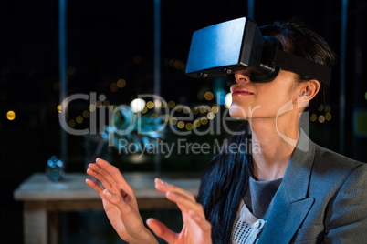 Businesswoman using virtual reality headset