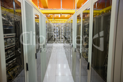 Hallway with a row of servers