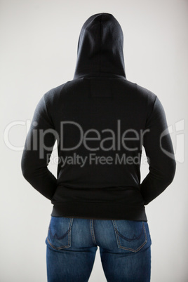 Rear view of spy in a hoodie