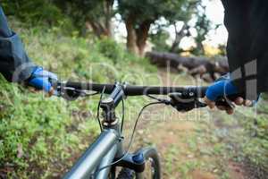 Close-up of male mountain biker riding bicycle