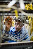 Technician fixing cable