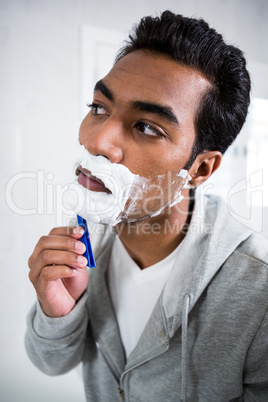 Man shaving in the bathroom