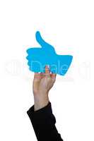 Hand of woman holding thumbs up sign board