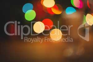 Defocused of christmas tree lights and fireplace