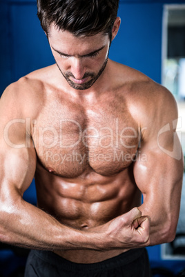 Male athlete flexing muscles