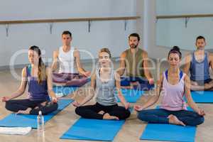 Group of people performing yoga