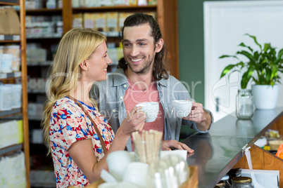 Couple having coffee in supermarket