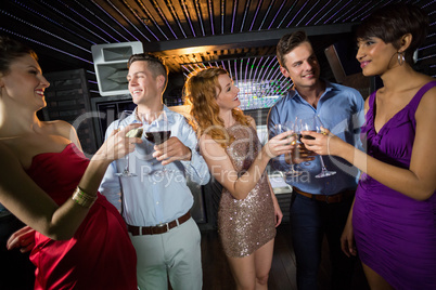 Group of friends toasting glasses of champagne and wine