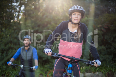 Biker couple cycling in countryside