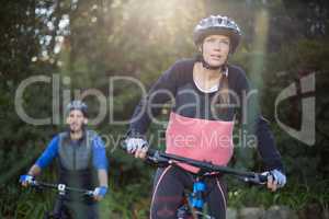 Biker couple cycling in countryside