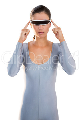 Woman in exercise outfit using virtual video glasses