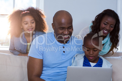 Happy family using laptop Happy family using laptop