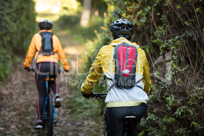 Biker couple cycling in countryside