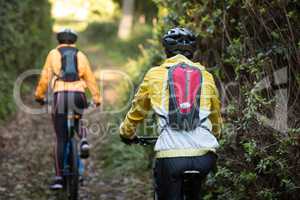 Biker couple cycling in countryside