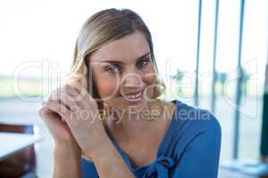 Smiling woman sitting in a coffee shop