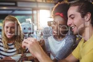 Man and woman using mobile phone