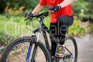 Male cyclist cycling in countryside