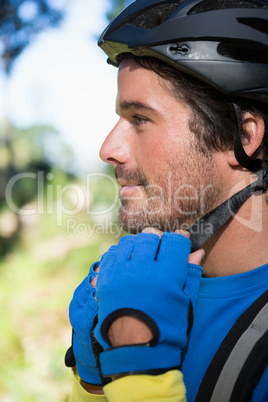 Male mountain biker wearing bicycle helmet