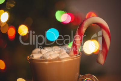 Cup of coffee with marshmallow and candy cane