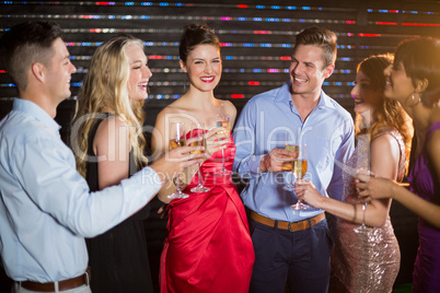 Group of friends having glasses of champagne