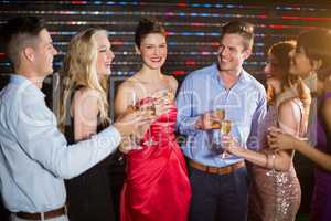 Group of friends having glasses of champagne