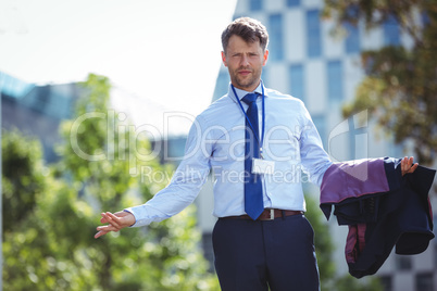 Portrait of handsome businessman standing with blazer
