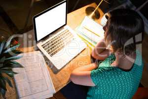 Businesswoman working on laptop