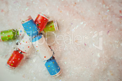Close-up of christmas crackers on snow