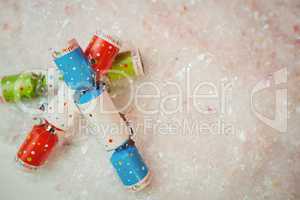 Close-up of christmas crackers on snow