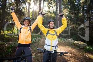 Biker couple with mountain bike in countryside