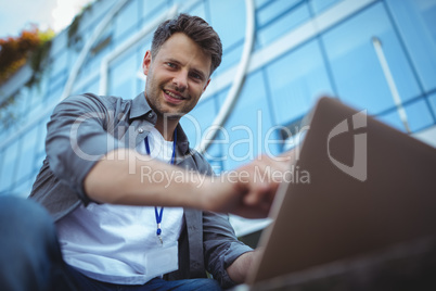 Portrait of business executive using laptop