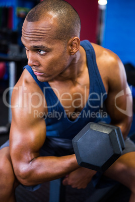 Athlete exercising with dumbbell