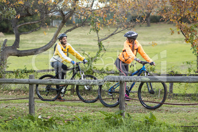 Biker couple interacting while cycling