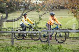 Biker couple interacting while cycling