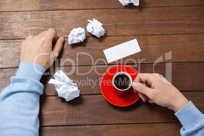 Man holding cup of coffee