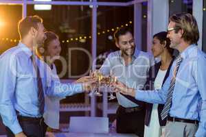 Businesspeople toasting glasses of champagne