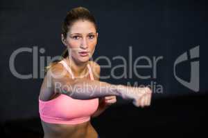 Woman practicing boxing in fitness studio