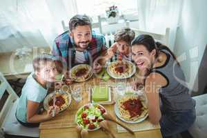 Elevated  view of family having meal together