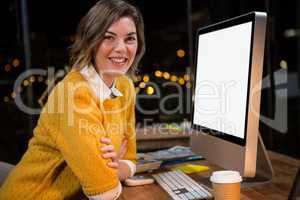 Businesswoman sitting at her desk