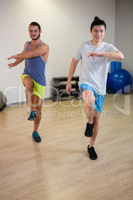 Portrait of two men doing aerobic exercise