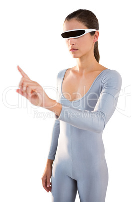 Woman in exercise outfit using virtual video glasses and pointing
