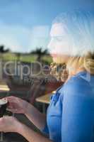 Thoughtful woman holding a coffee cup