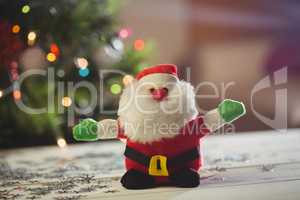 Close-up of santa claus on wooden table