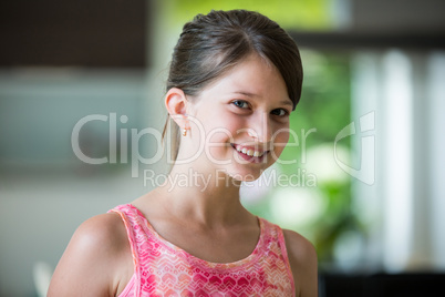 Portrait of smiling girl in living room