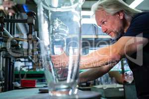 Glassblower working on a glass