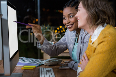 Businesswomen working on computer at their desk